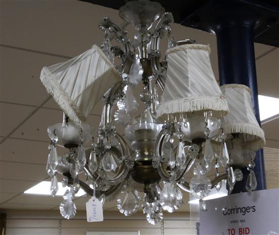 A brass and cut glass chandelier